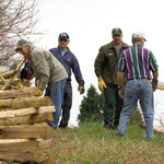Volunteers help build fences