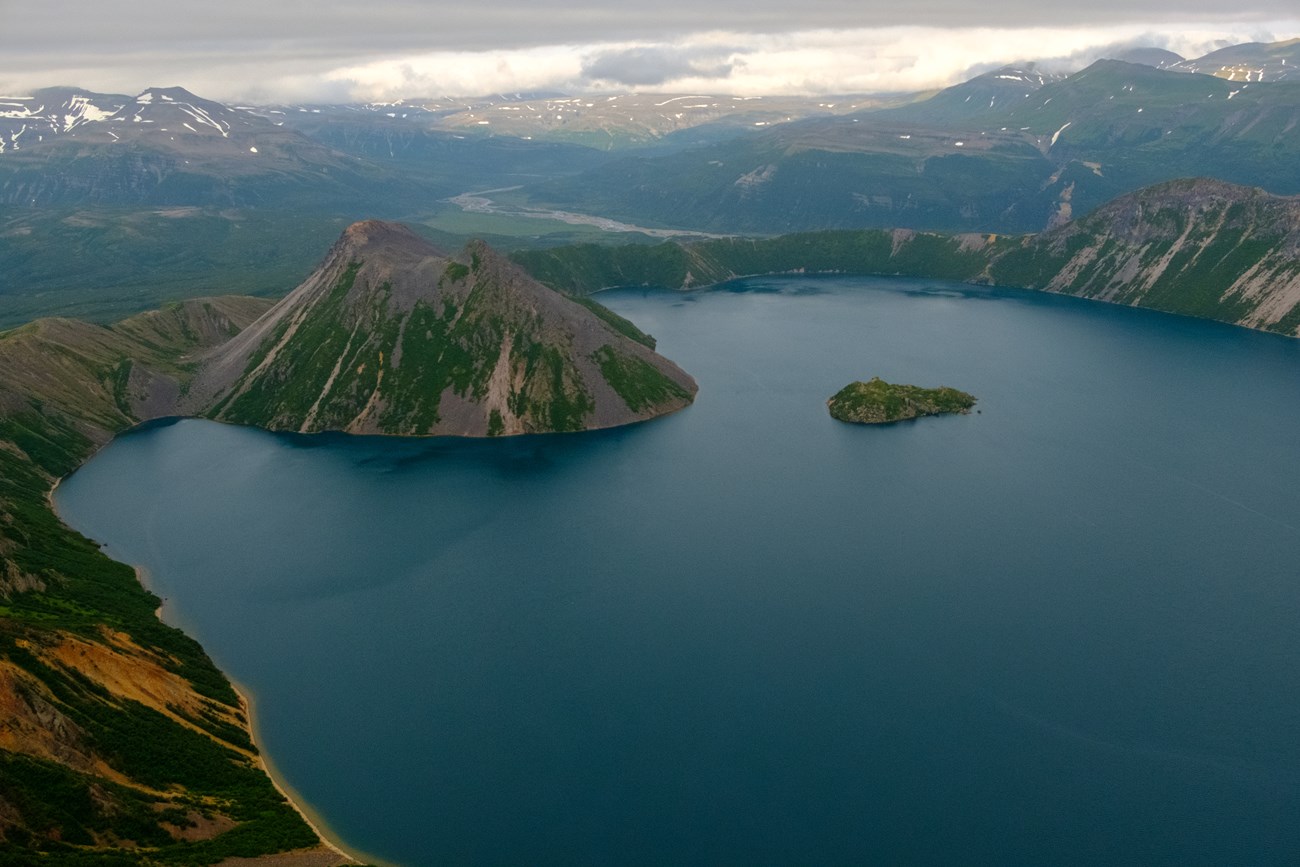 lake in a volcanic crater with domes projecting above the water level