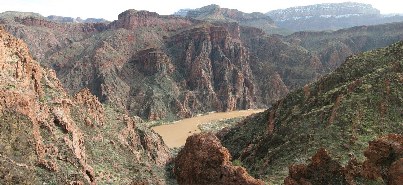 Photo of Colorado River and the cliffs and buttes of Grand Canyon.