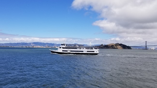 a ferry boat travels to Alcatraz