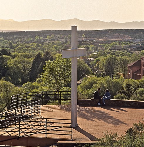 The Cross of the Martyrs memorial to 21 Franciscan priests and friars killed during the 1680 Pueblo Revolt stands steps below the ruins of Fort Marcy in Santa Fe, providing another point of visitor interest. Photo © Jack Parsons