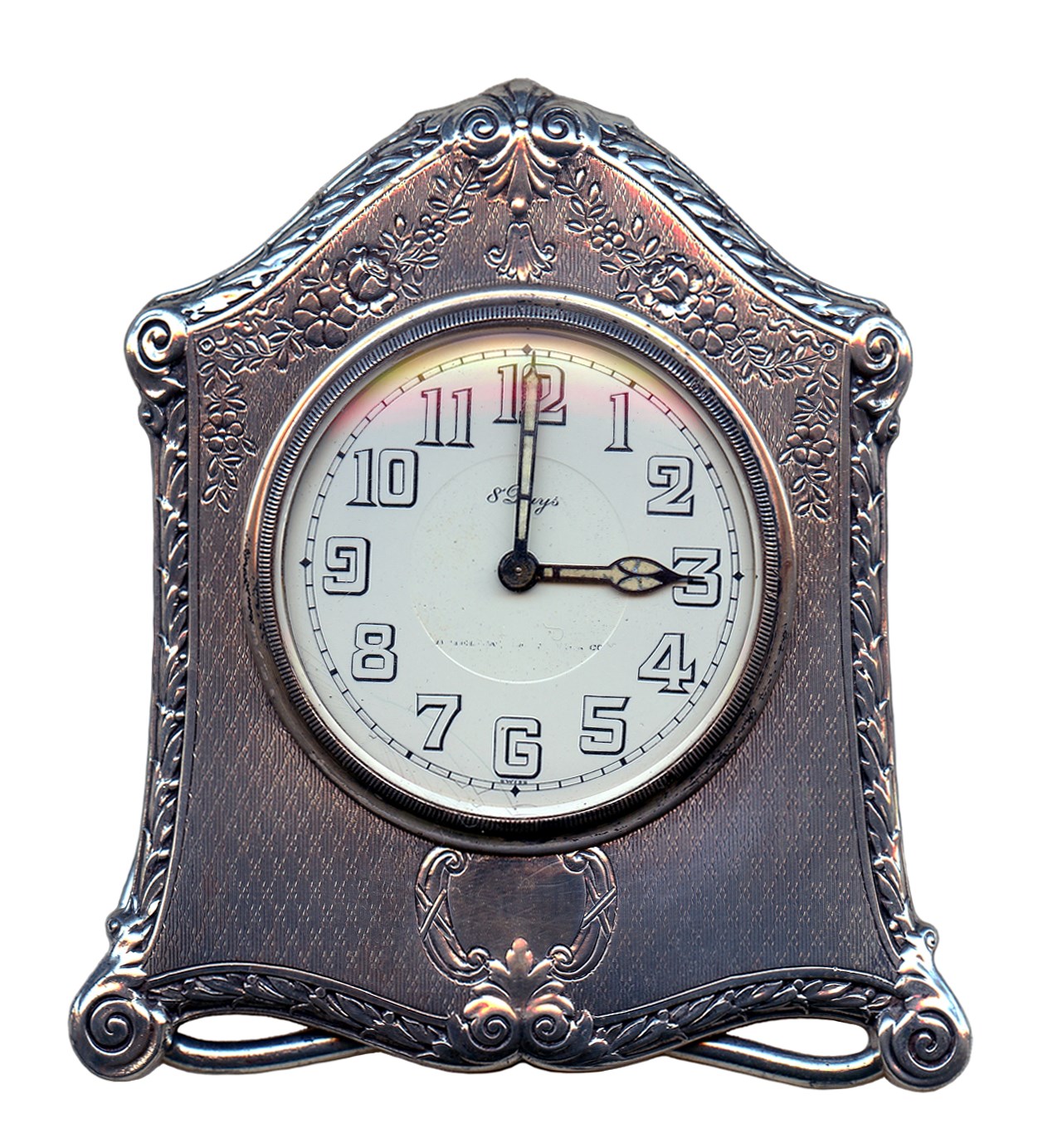 Small clock with silver frame and feet, set to 3:00