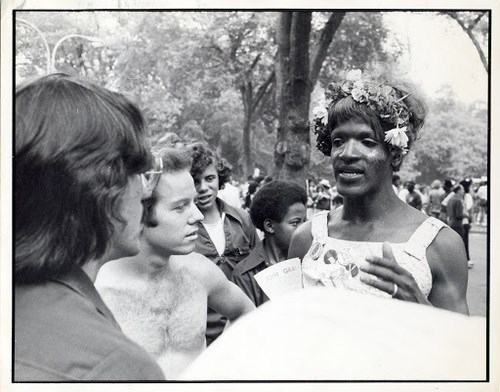 Marsha P. Johnson speaking with a group of people at a protest