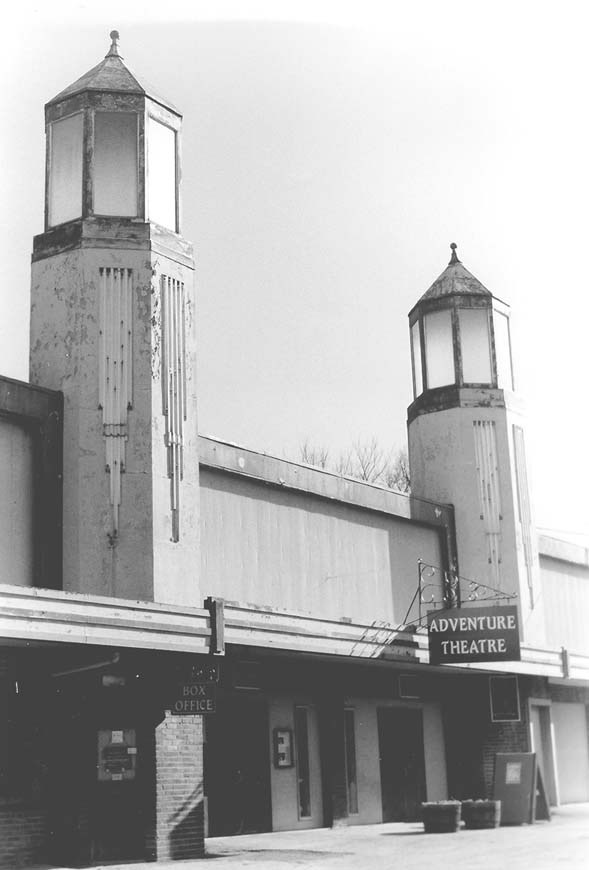 Front of an arcade with a sign reading "adventure theatre."