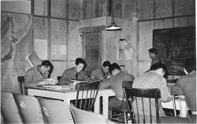 Japanese American men learning at the Military Intelligence Service Language School at the Presidio