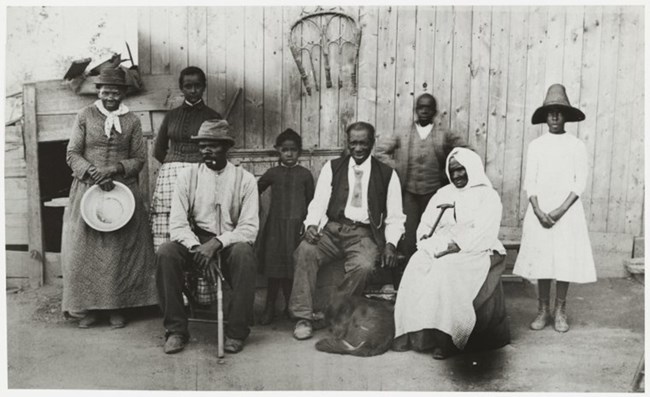 Tubman stands beside her family members.