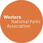 Western National Parks Association in white text in an orange circle.