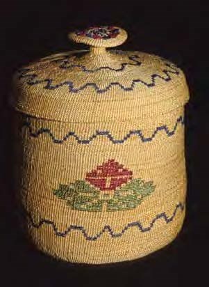 Woven basket with flower design and lid with a woven knob