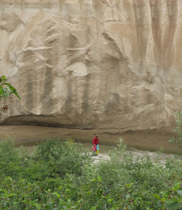 pyroclastic deposit forms cliff along stream bank
