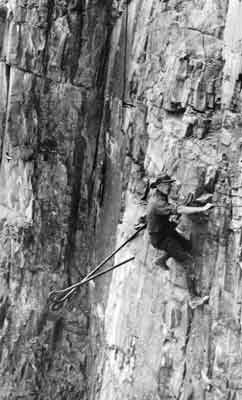 Worker on a sheer cliff face.