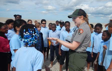 Ranger with students on beach