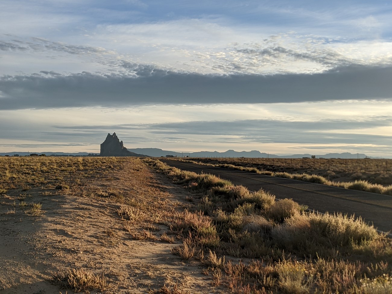 Shiprock, known as Tsé Bitʼaʼí in the Diné language, as seen from the highway in Fall 2021.