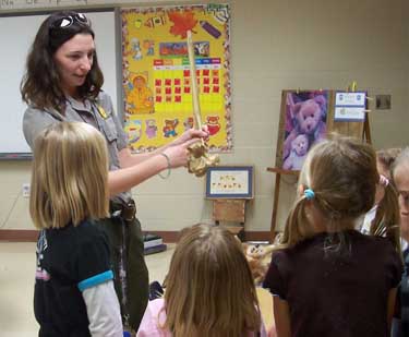 ranger talks to children in classroom