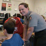 Ranger assisting students during an education program