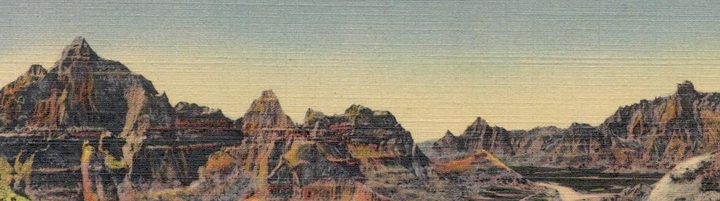 a vintage color postcard with jagged badlands buttes push up into a sky that fades from white to blue
