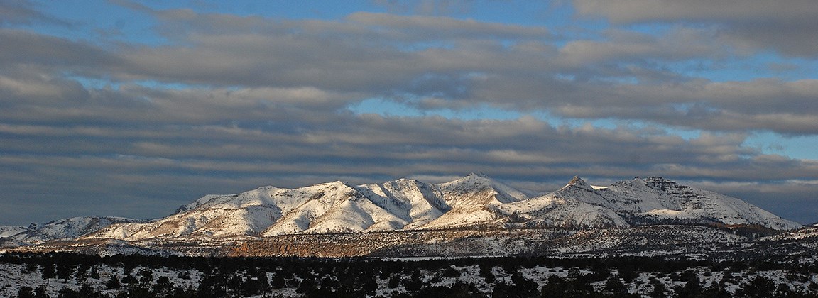 small pointed mountains covered in snow