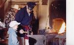 Kids work with blacksmith