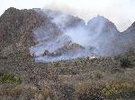 5:47pm; fire spreads to higher elevations