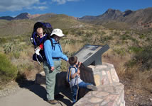 Family viewing a wayside exhibit