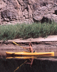 A visitor stands at the mouth of Santa Elena Canyon