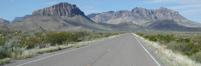 Nugent Mountain and Pummel Peak rise above the road.