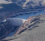 Aerial view of Yellowtail Dam at mouth of canyon