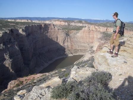 Hiker on the edge of Bighorn Canyon