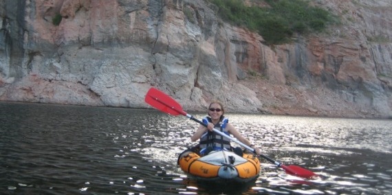 Visitor enjoys kayaking through the canyon