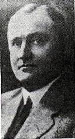 A grainy black and white image of Walter G. Langford wearing a suit.