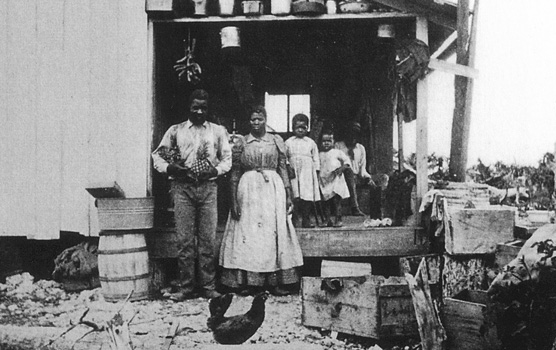 A young Jones family on the porch of their home on Porgy Key.