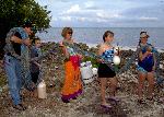 Family collects trash from Elliott Key shoreline.