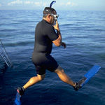 Snorkler jumps into the water