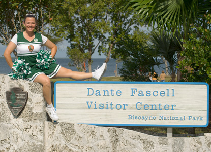 A very enthusiastic cheerleader welcomes participants to the Reef Rally Family Fun Fest.