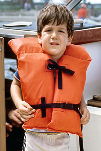 Young boy wearing lifejacket