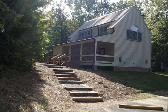 bath house in campground with newly mulched ground where work has been done on steps
