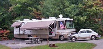 RV and car in camping station