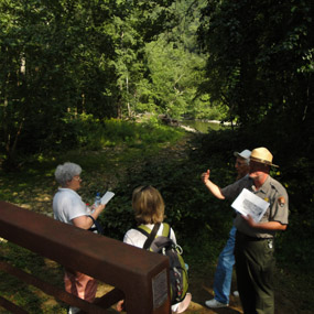 a ranger talking to visitors at Lilly