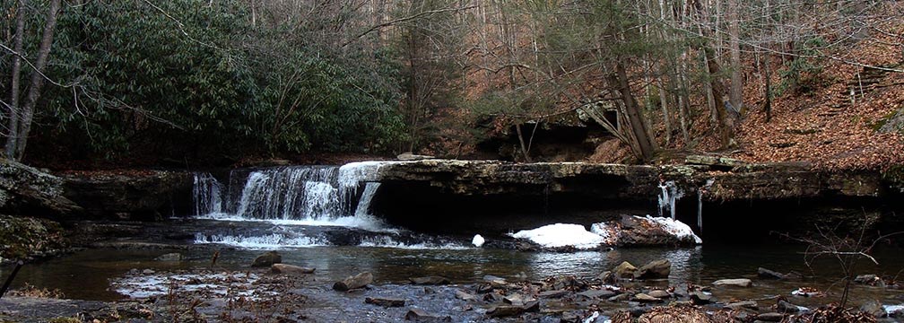 small waterfall over rock ledge