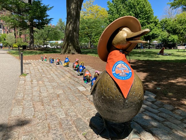 Boston's Make Way for Ducklings statue wearing BHI gear