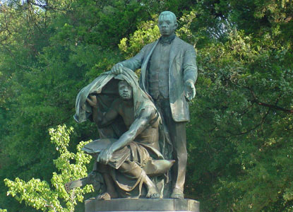 Image of famous statue at Tuskegee University. Washington lift veil from 
