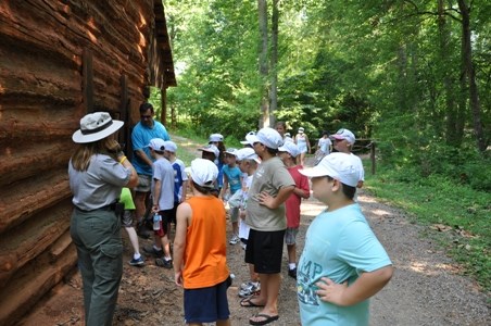 Children learning about the Tobacco Barn