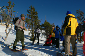 ranger guiding a snowshoe hike