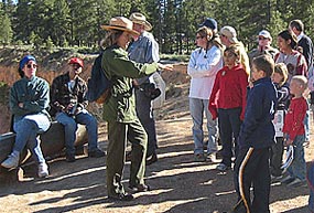 Park Ranger interacting with visitors during an Interpretive progam along the rim of Bryce Canyon