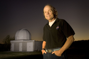 Patrick Wiggins with observatory in background