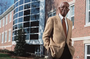 Dr. John Hope Franklin in front of the building at Duke university that bears his name.