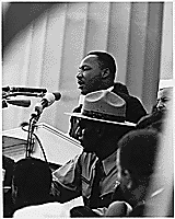 Image of Rev. Martin Luther King Jr. speaking in front of the Lincoln Memorial.