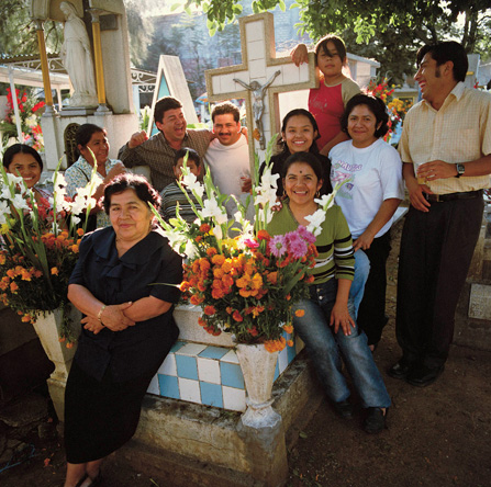 Oaxacan family celebrating Dia de las Muertos.