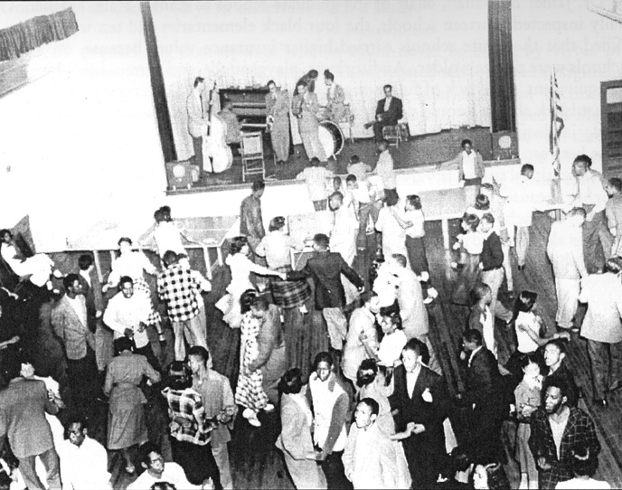 Image of high school students dancing the Monroe School auditorium taken in the 1940s.