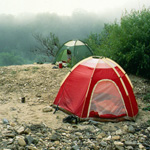Red tent on a gravel bar along the Buffalo National River