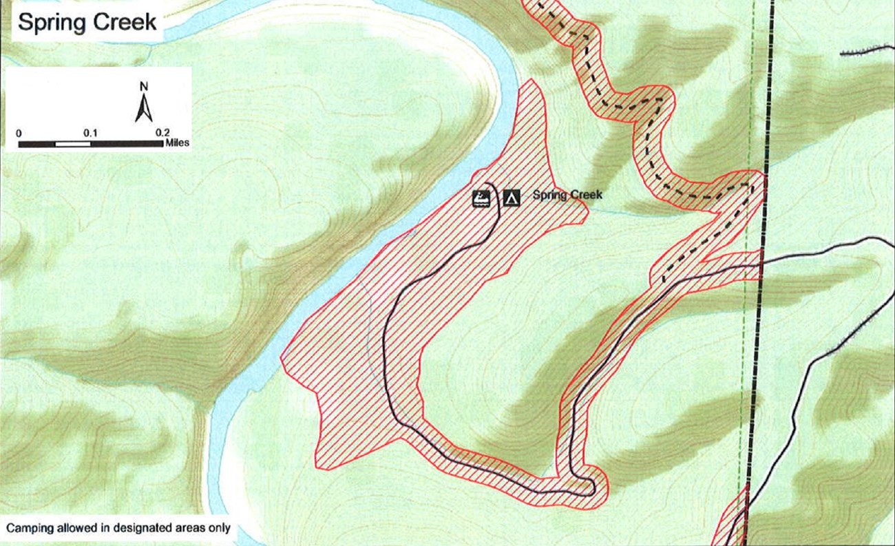 topographic map with saftey zone no hunting shaded red, road solid black lines, trails dashed black lines, mileage and compass direction at top left